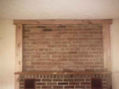 removed plaster wall and exposed brick with trim