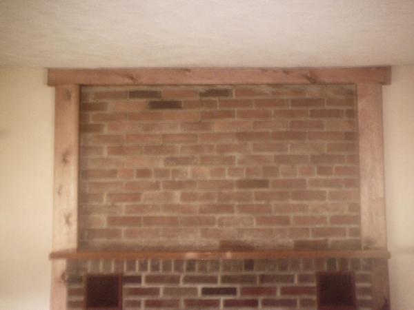 removed plaster wall and exposed brick with trim